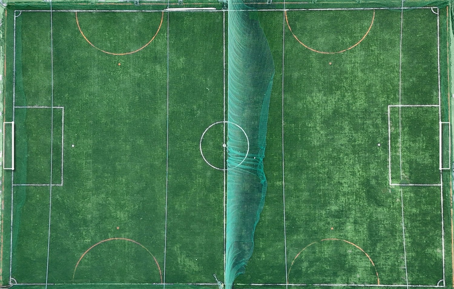 Aerial view of the turf split into two 5-a-side courts by a net