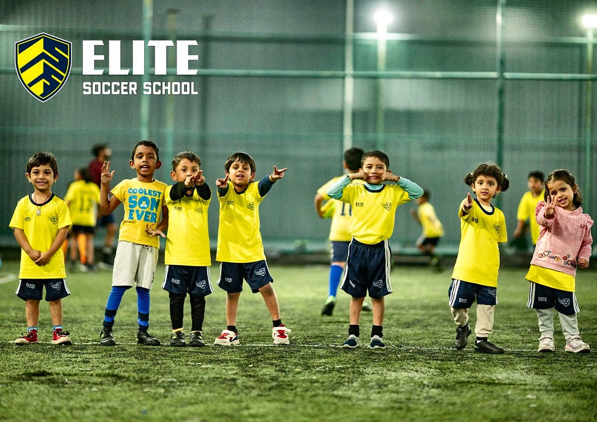 Young Elite Soccer School players posing on the pitch