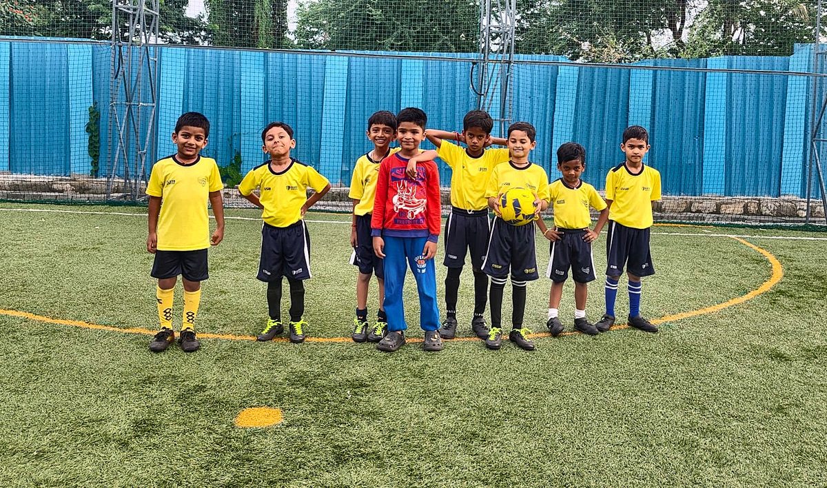 Elite Soccer School players lined up on the centre circle