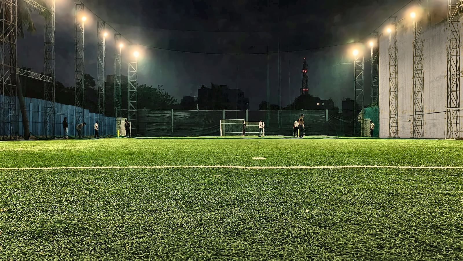 The Big Box Turf at night under the floodlights
