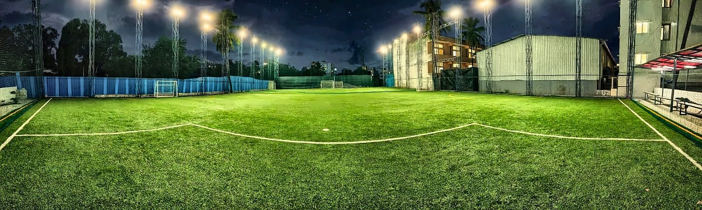 Panoramic view of the full turf at night with floodlights on